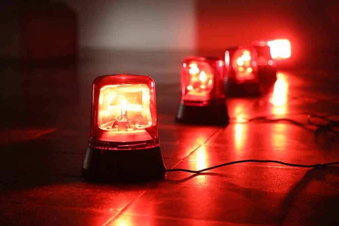 1042134532 featured image Red emergency lights on a dark floor.