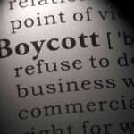 Boycott definition highlighted in dictionary page closeup