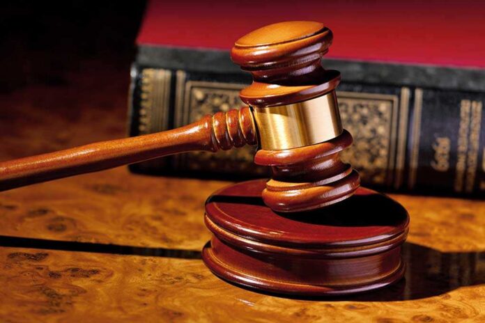 171897389 featured image Judges gavel beside a law book