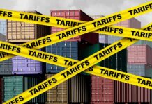 Shipping containers covered with yellow tariff tape