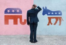 Man deciding between elephant and donkey symbols