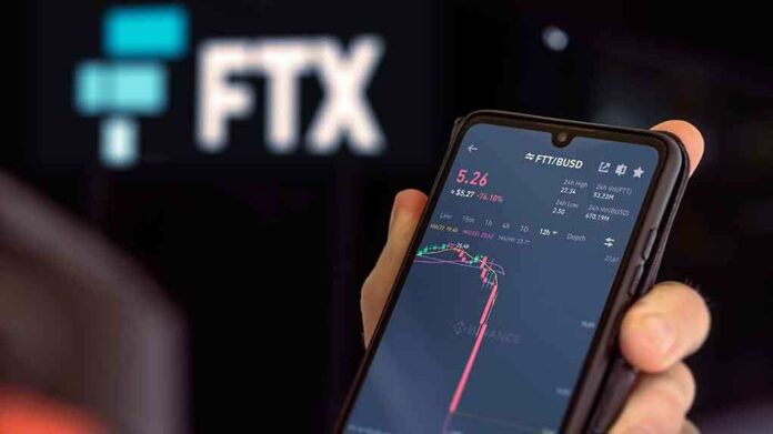 2224048131 featured image Hand holding phone with FTX trading app