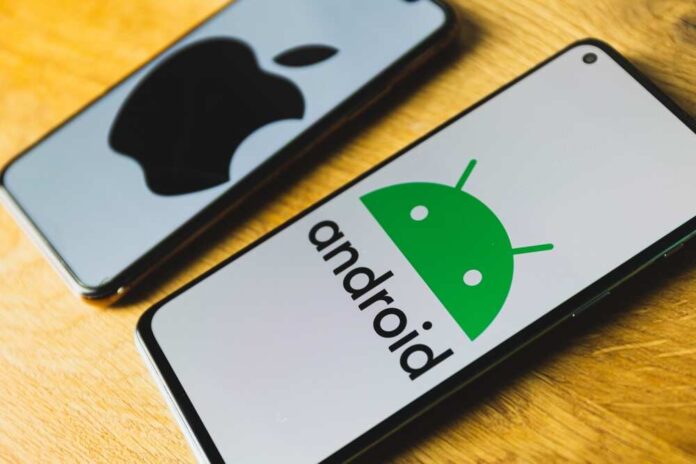 2271607647 featured image Android and Apple smartphones on a wooden table