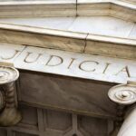 Marble columns with the word Judicial engraved above