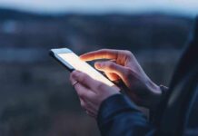 Person using a smartphone at dusk