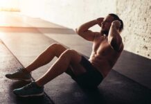Man doing situps in a gym setting