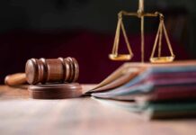 Judges gavel, scales of justice and legal documents