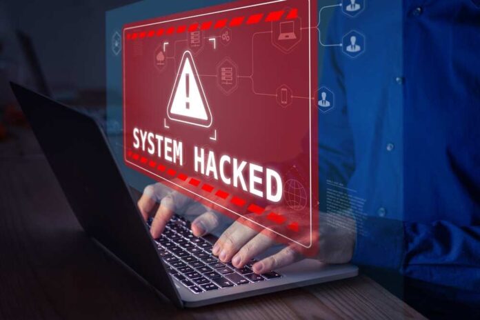 Warning sign System Hacked on laptop screen