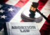Abortion law book gavel and American flag