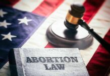 Abortion law book gavel and American flag