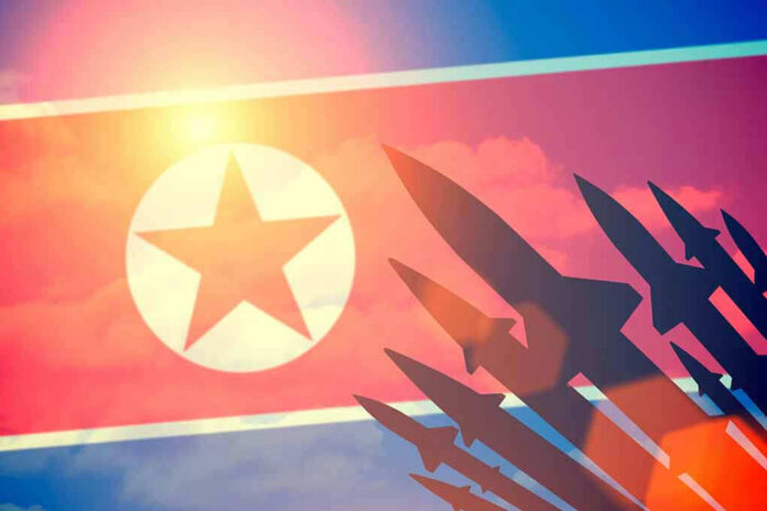 395414536 North Korean flag with missile silhouettes