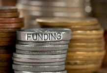 Stack of coins labeled funding with other coins stacks