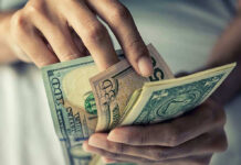 Person holding multiple US money