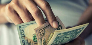 Person holding multiple US money