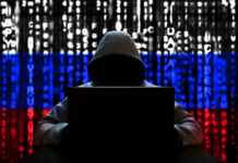 Russian Cyber Attack Sparks U.S. Security Panic Hacker in hoodie with Russian flag background and code.