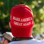 Person wearing a red Make America Great Again hat.