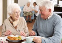 Shocking Study: Simple Diet Change Fights Dementia Elderly couple enjoying a meal together in a dining room