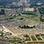 Aerial view of the Pentagon surrounded by highways and urban areas