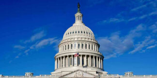 US Capitol Building against blue sky.