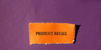 Product Recall text on orange paper, purple background.