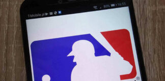 Major League Baseball logo on a smartphone screen.