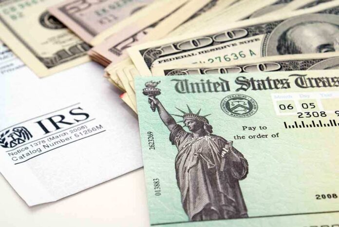 A tax refund check from the IRS alongside various denominations of cash