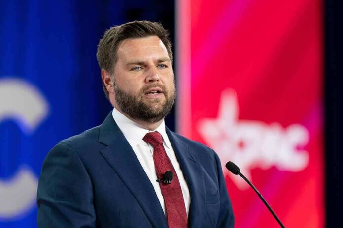 A man in a suit speaking at a podium during a conference