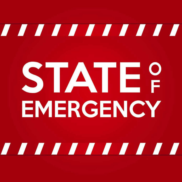 STATE OF EMERGENCY in bold white text on red background.