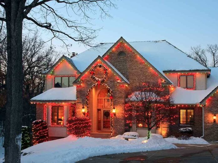 A beautifully decorated house with Christmas lights in a snowy setting