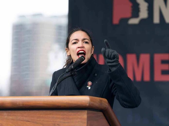 A woman passionately speaking at a podium during a rally