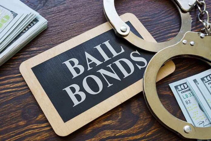 A bail bonds sign with handcuffs and stacks of cash