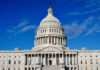 US Capitol Building against blue sky.