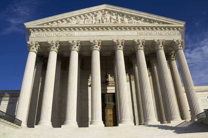 shutterstock_103670531.jpg Facade of the Supreme Court building featuring tall columns and intricate carvings