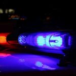 SICKO Illegal Alien BITES Toddler’s Face—Two Teeth GONE! Close-up of police lights flashing in blue and red at night