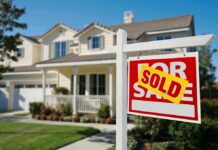 Germany’s Housing Market Gets A Political Veto A house with a Sold sign in the front yard