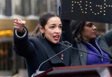 Viral AOC GAFFE Sparks Outrage Person speaking passionately at outdoor event.