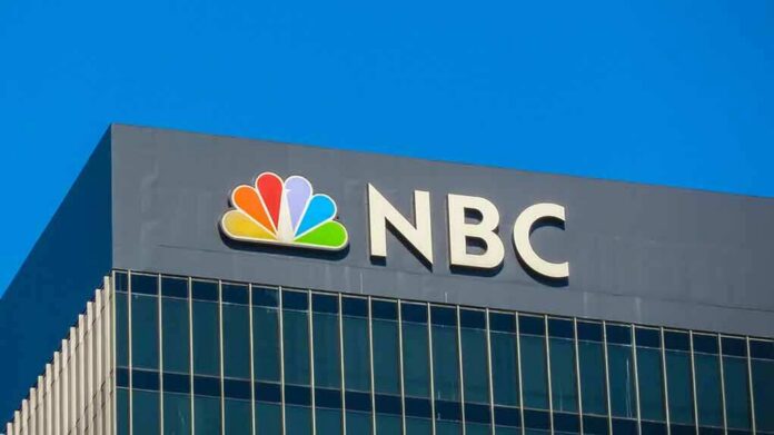 shutterstock_1211618743-1- NBC logo displayed on a corporate building against a blue sky