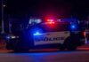 Houston police vehicle with emergency lights activated at night