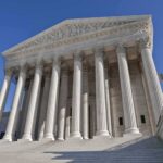 Supreme Court Votes 9-0, Bipartisan SHOCKER! The Supreme Court building featuring grand columns and statues under a clear blue sky