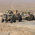 Secret Israeli Base Exposed: Iraq Tensions Soar Two military humvees with soldiers in a desert landscape