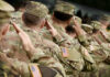 National Guardsman MURDERS Colleague After Tryst! Soldiers in camouflage uniforms saluting in formation outdoors