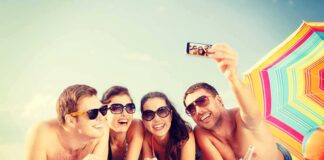 Group of friends taking a selfie on the beach