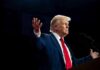 Trump’s Pastor Scandal Implodes Overnight A man in a suit gesturing during a speech