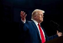 Trump’s Pastor Scandal Implodes Overnight A man in a suit gesturing during a speech