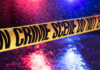 State Trooper MAULED By Drunk Driver! Yellow crime scene tape with police lights in background.