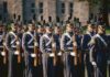 Uniformed soldiers in formation during a military parade