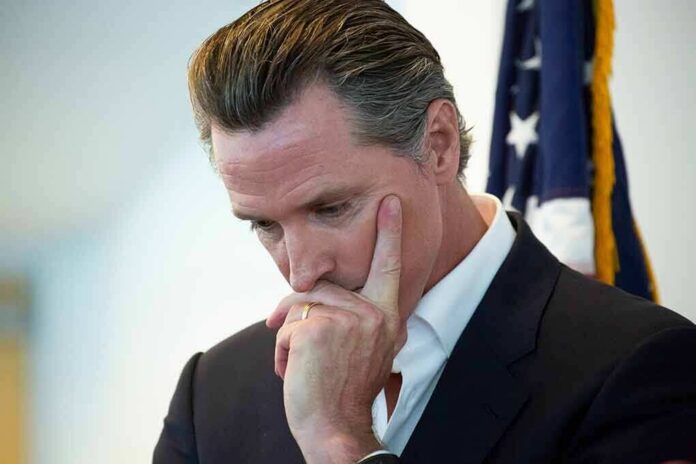shutterstock_1747778459 man in suit touching his face thoughtfully