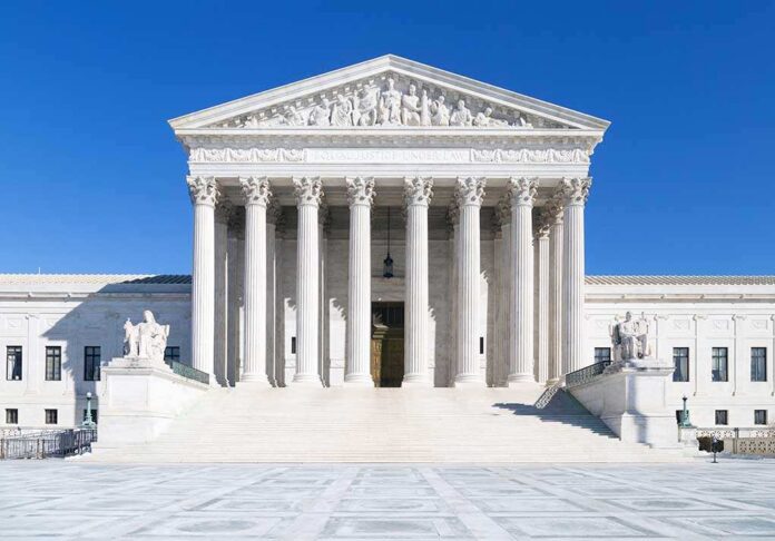 Us,Supreme,Court,,Washington,Dc The Supreme Court building featuring marble columns and a clear blue sky