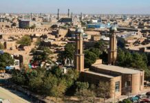 Aerial view of a city featuring traditional buildings and minarets