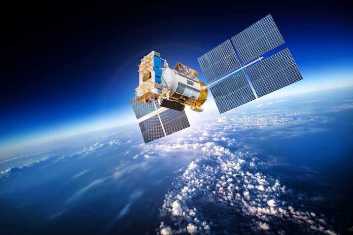 Space,Satellite,Orbiting,The,Earth.,Elements,Of,This,Image,Furnished A satellite equipped with solar panels orbiting above the Earth